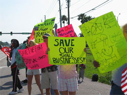 Photograph of people protesting the opening of a new Wal-Mart.